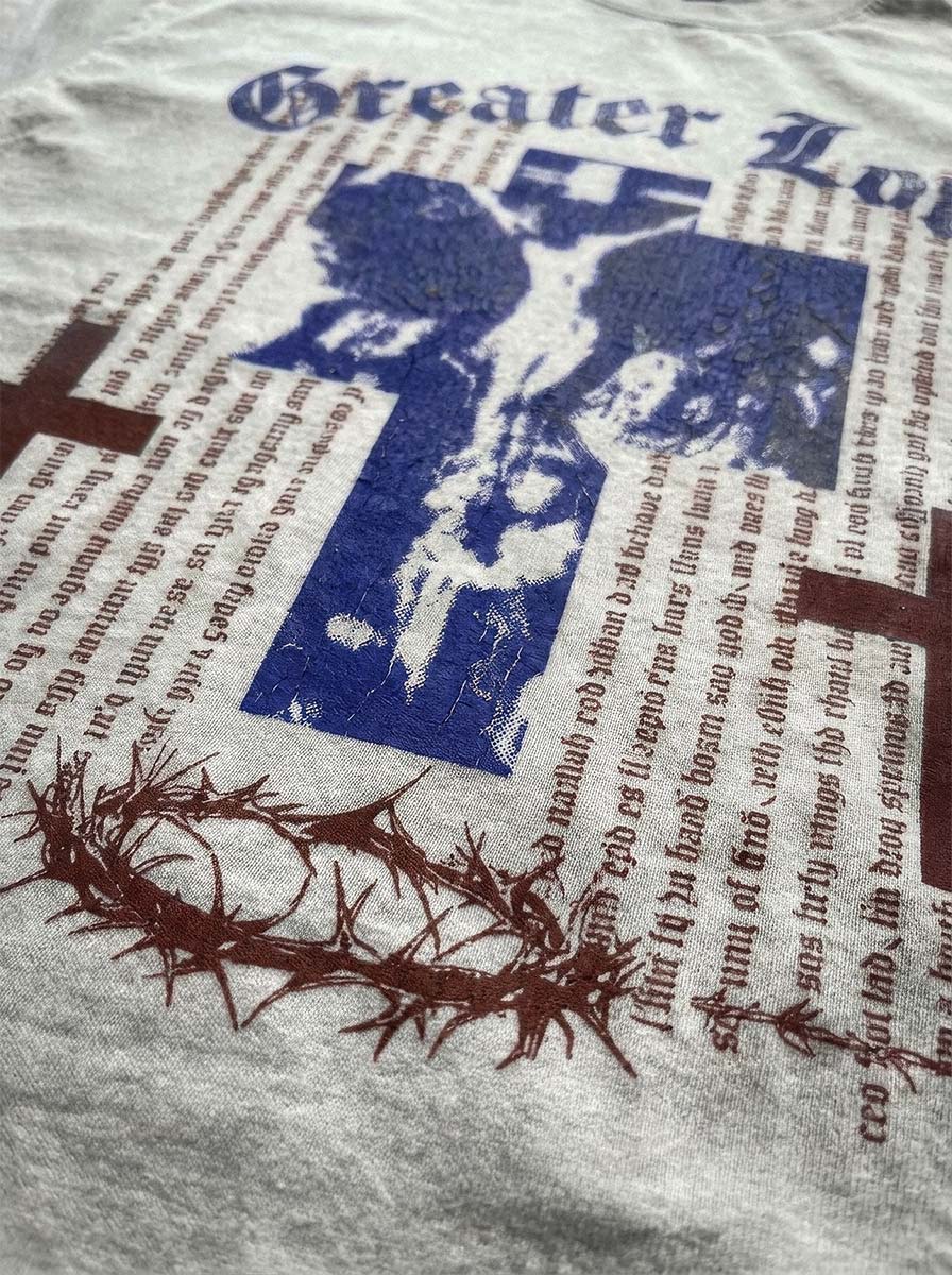 Close-up of the Greater Love tee print and heavyweight fabric